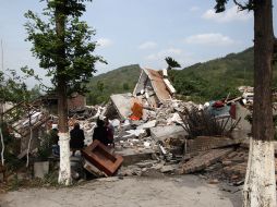 Por lo menos unas 10 mil viviendas resultaron destruidas o seriamente dañadas por el sismo. AFP /