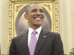 Barack Obama y su esposa se pondrían el mismo tatuaje y en el mismo lugar si sus hijas deciden ''rebelarse''. ARCHIVO /