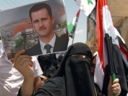 En la foto, simpatizantes del régimen de Bashar al-Assad. AFP /