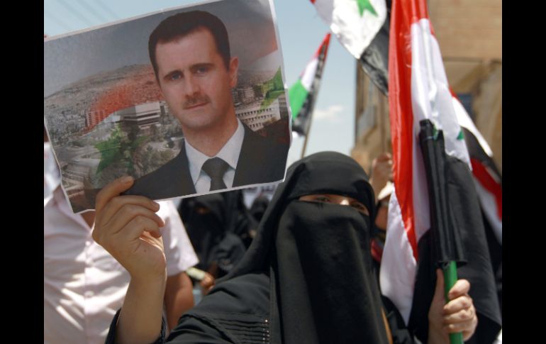 En la foto, simpatizantes del régimen de Bashar al-Assad. AFP /