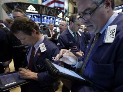 Wall Street cierra por tercera semana consecutiva con ganancias. AP /
