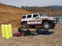 Elementos de Protección Civil participan en el rescate de los cuerpos de un adulto y un menor de edad en la laguna Vista Hermosa.  /