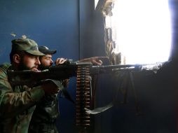 Soldados del Ejército sirio en un puesto de vigilancia en el área de Jarba, zona rural de Damasco. EFE /