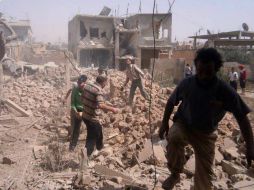 Entre las víctimas del ataque a la ciudad de Qusair se incluyen 48 combatientes, tres mujeres y un varón civil. AP /