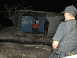 Los tres sujeto fueron ejecutados cuando se encontraban viendo la televisión dentro de una casa de la calle Juan Escutia. ESPECIAL /