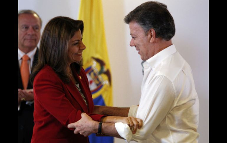 Los jefes de Estado Laura Chinchilla, de Costa Rica, y Juan Manuel Santos, de Colombia. AP /