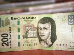 La fortaleza del peso como moneda es la principal razón de la desaceleración económica del primer semestre de 2013. ARCHIVO /