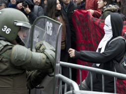 En la marcha se presentaron enfrentamientos entre la policía y los manifestantes. AFP /