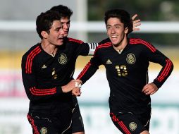 Abella (13) celebra el gol que anotó en el juego ante Nigeria. AFP /