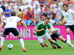 Miroslav Klose recibe una falta en el juego de Alemania ante Estados Unidos. EFE /
