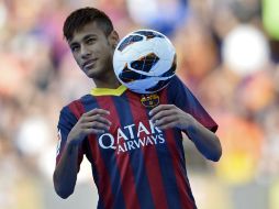 El astro brasileño iniciará su aventura europea con el Barsa. AP /