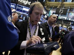 La jornada de la Bolsa de Nueva York termina con alzas en sus indicadores. AP /