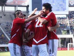 Los jugadores de Egipto festejan uno de los goles en el partido ante Zimbabue. AP /