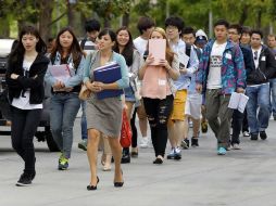 La universidad reabrió hoy sus puertas, por lo que los estudiantes pudiendo entrar a recoger pertenencias. AP /