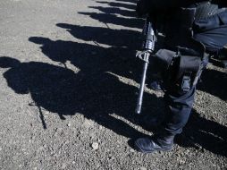 La policía busca el resto de los cuerpos en la zona donde se ubicaron los restos. ARCHIVO /