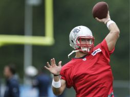 Tebow ya hizo una práctica con los Patriotas. ARCHIVO /