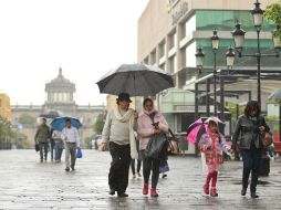 El SMN reporta que habrá nublados densos con precipitaciones moderadas a fuertes en Jalisco. ARCHIVO /