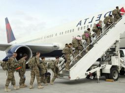 La permanencia de un contingente militar menor para instrucción de afganos contra bombas es una de las condiciones. ARCHIVO /
