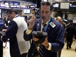 Durante la jornada se da a conocer que la mitad de los miembros de la Fed apoyan el fin de los estímulos este año. AP /