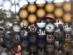 Los jóvenes buscaban emitir una crítica a Obama por la cifra récord de deportaciones registrada durante su gobierno. AP /