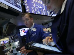 La jornada en la bolsa de NY estuvo marcada por la cautela ante la reunión de la FED que se realizará mañana. AP /