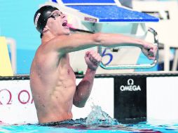 Efusivo. César Cielo festeja tras culminar en el primer lugar de la prueba de 50 metros mariposa. AP /