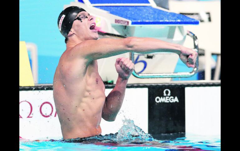 Efusivo. César Cielo festeja tras culminar en el primer lugar de la prueba de 50 metros mariposa. AP /
