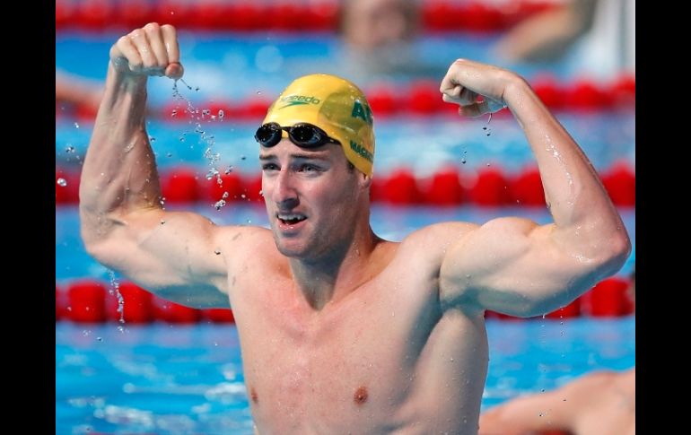 James Magnussen levanta los brazos al saberse ganador de los 100 metros libre de los Mundiales de Barcelona 2013. AP /