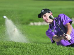 Jim Furyk saca un golpe de ventaja en la punta del torneo a su compatriota Jason Dufner. AP /