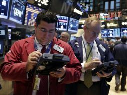 La Bolsa de Nueva York finaliza hoy con ganancias moderadas en su principal indicador. AP /