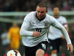 Desde la llegada de David Moyes al ManU, Wayne Rooney pidió salir del equipo; aún no se sabe si saldrá o se quedará. AFP /