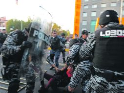 Manifestantes y elementos policiacos se enfrentaron durante la manifestación del pasado 1 de diciembre. EL INFORMADOR /