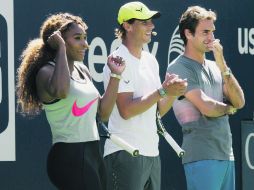 Serena Williams, Rafael Nadal y Roger Federer durante la 18va edición del ''día de los niños'' del Abierto de Estados Unidos. AP /