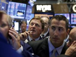 La posible acción militar en Siria encabezada pro EU impacta negativamente en la jornada de Wall Street. AP /