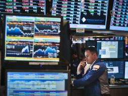 El principal indicador en Wall Street cerró con una baja de 30.64 puntos. AFP /