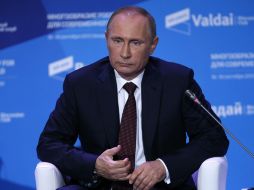 Vladímir Putin dijo que él no puede asegurar al cien por cien que Siria cumpla el plan de eliminación de sus armas químicas. AFP /