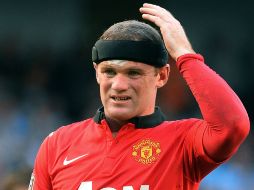 Wayne Rooney marca el de la ''honra'' para los dirigidos por David Moyes. AFP /