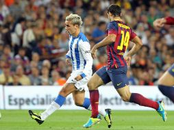 Tras un choque con Busquets, el zaguero no pudo terminar el encuentro ante Real Sociedad. EFE /