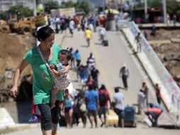 Paña Nieto se encuentra en Coyuca, Guerrero, en donde el puente que conecta con ciudad Altamirano se cayó. AFP /