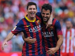 Messi (i) anotó el primer gol al 21', minutos después pidió su cambio por problemas musculares. AFP /