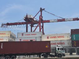 A container truck drives along a pier at Taiwan