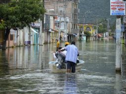 Recomiendan precaución ante posibles inundaciones pluviales y fluviales, deslaves. NTX /