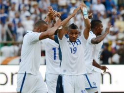 Con su victoria, Honduras se afianza en el tercer lugar del hexagonal, que da un boleto directo al Mundial de Brasil. AFP /