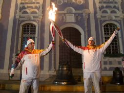 El símbolo de los Juegos sigue dentro del país en espera de los miles de relevistas. AFP /