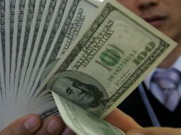 Banco Base estima que el tipo de cambio cotice entre 12.99 y 13.09 pesos por dólar. ARCHIVO /