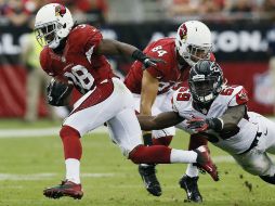 Andre Ellington (I) tuvo un acarreo de anotación de 80 yardas. AP /