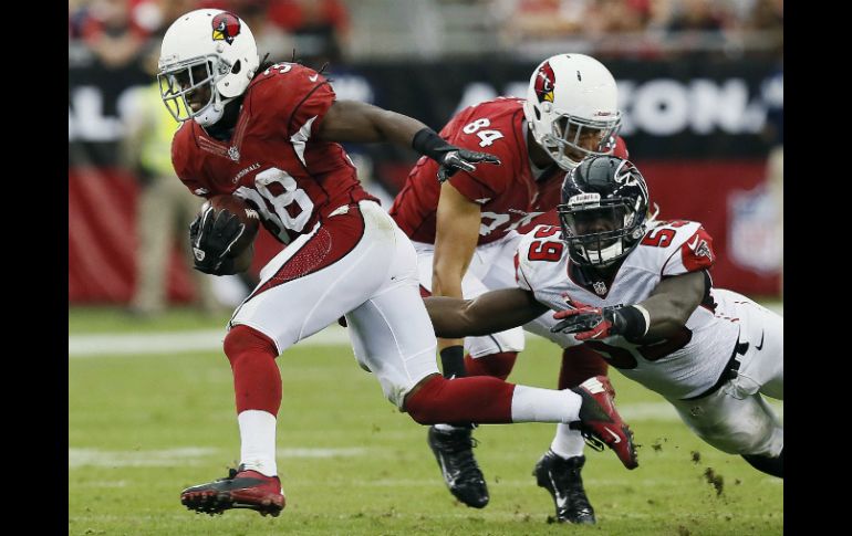 Andre Ellington (I) tuvo un acarreo de anotación de 80 yardas. AP /