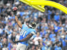 Superior. Calvin Johnson festeja luego lograr una anotación frente a los Vaqueros AP /