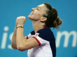 Simona vence a Stosur por tercera vez consecutiva. AP /