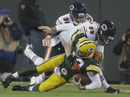 Rodgers se lesionó en esta jugada tras caer sobre su costado izquierdo después de una captura.  /